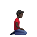 hombre de rodillas: tono de piel oscuro y hacia la derecha